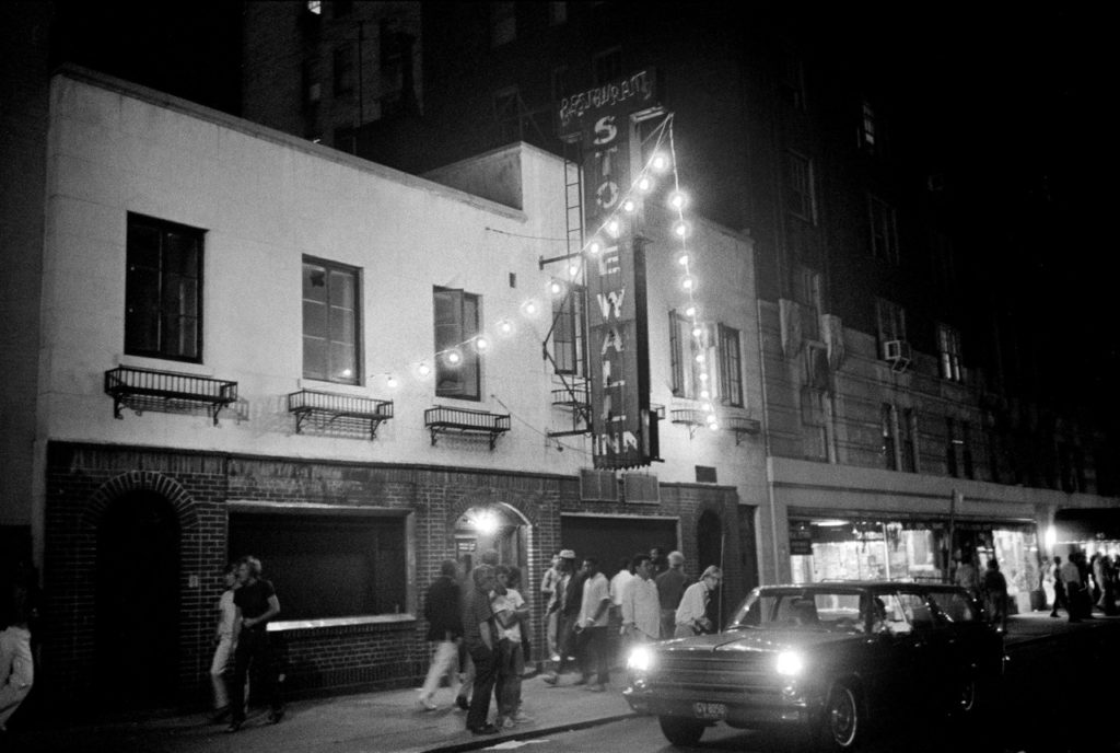 Black and white image of the Stonewall Inn at night.