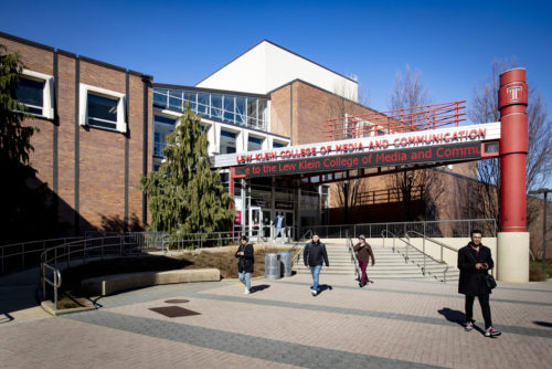 Students exiting the front of the Klein College building